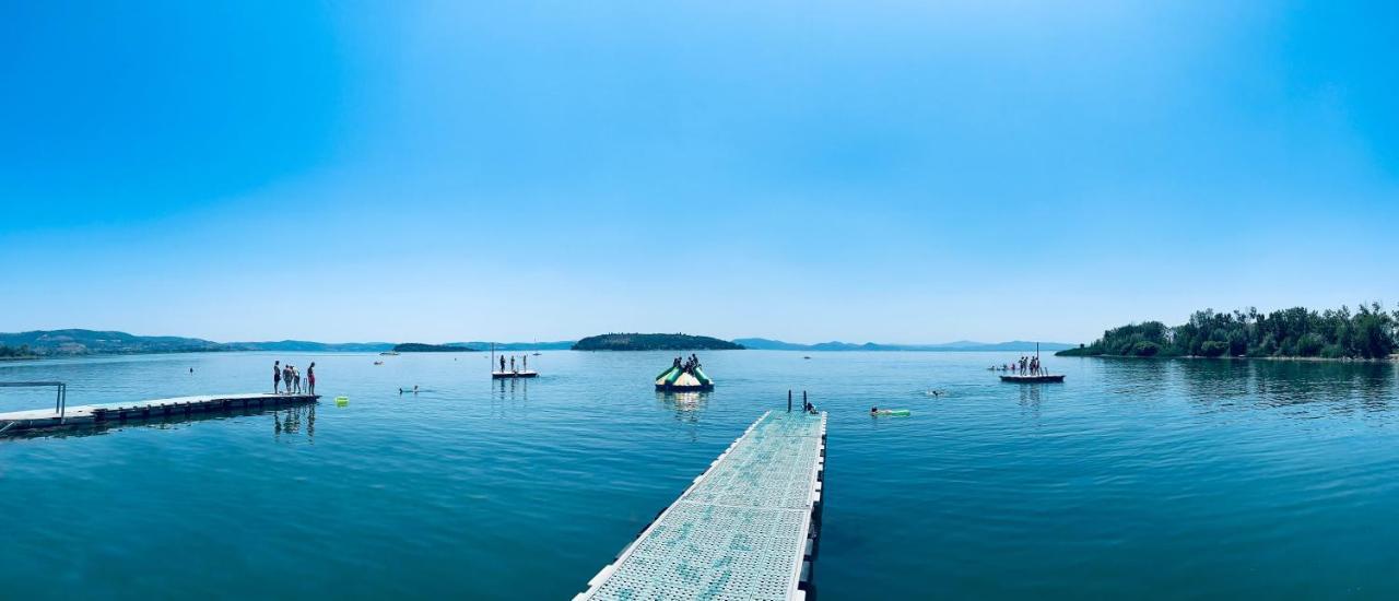 Camping Village Punta Navaccia ตัวโร ซุล ตราซิเมโน ภายนอก รูปภาพ
