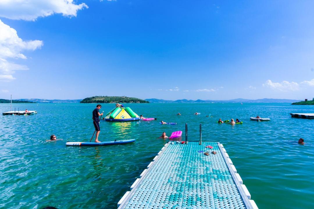 Camping Village Punta Navaccia ตัวโร ซุล ตราซิเมโน ภายนอก รูปภาพ